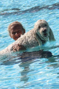 The Kansas City CC’s “Doggy Dip”  turned pool-closing day, previously a bittersweet occasion, into one that’s now anticipated as a top opportunity for full family fun. 