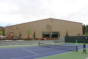 Crane Creek Country Club built two additional indoor tennis courts (above left) to “ride the wave” of tennis’ national growth and respond to the club’s 400% increase in tennis participation over 10 years. A stadium court was revamped and is now “a vibrant hub of activity,” according to General Manager Ben Hay.