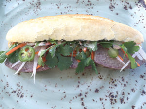 The “gastro pub meets street food” menus of the Ocean Reef Club food truck include featured items like a Vietnamese country pork paté banh mi.