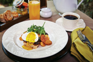 Dishes like Breakfast Benedict (left) feature farm-fresh eggs from free-range chickens raised on site.