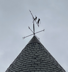 Golf weathervane on roof