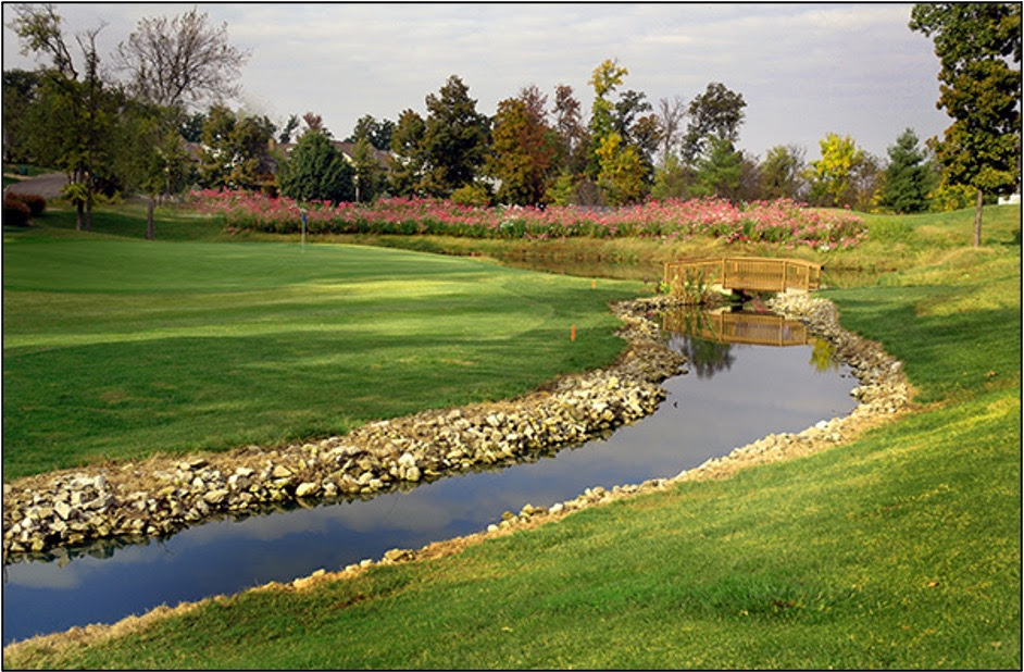 golf course with bridge over river