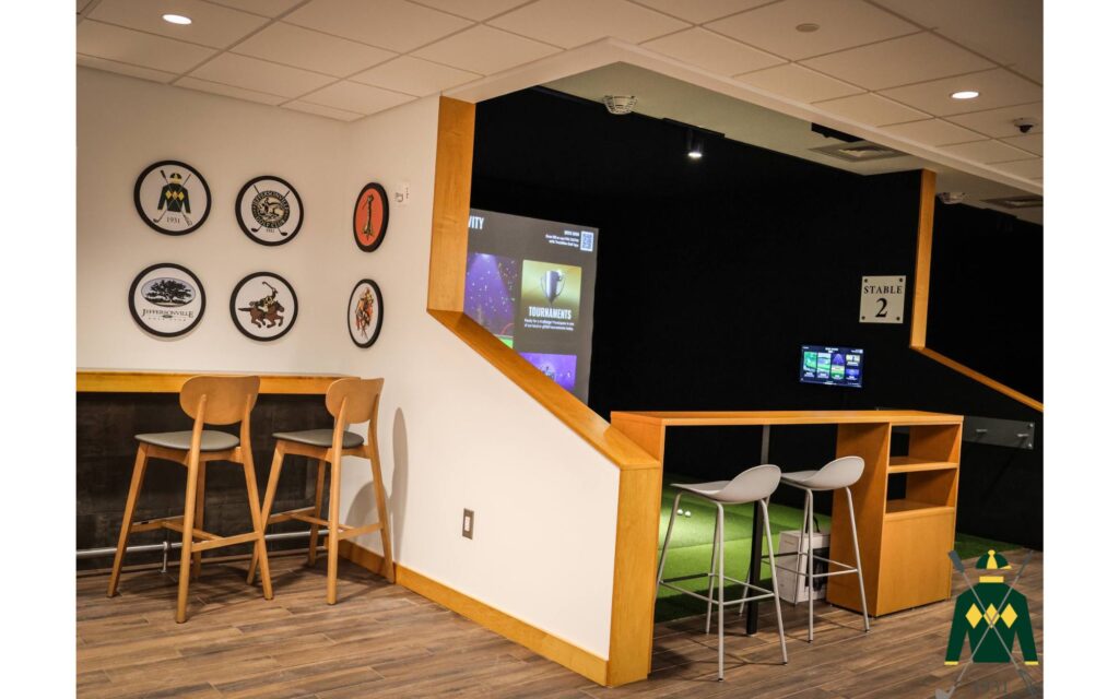 A golf simulator inside a clubhouse.